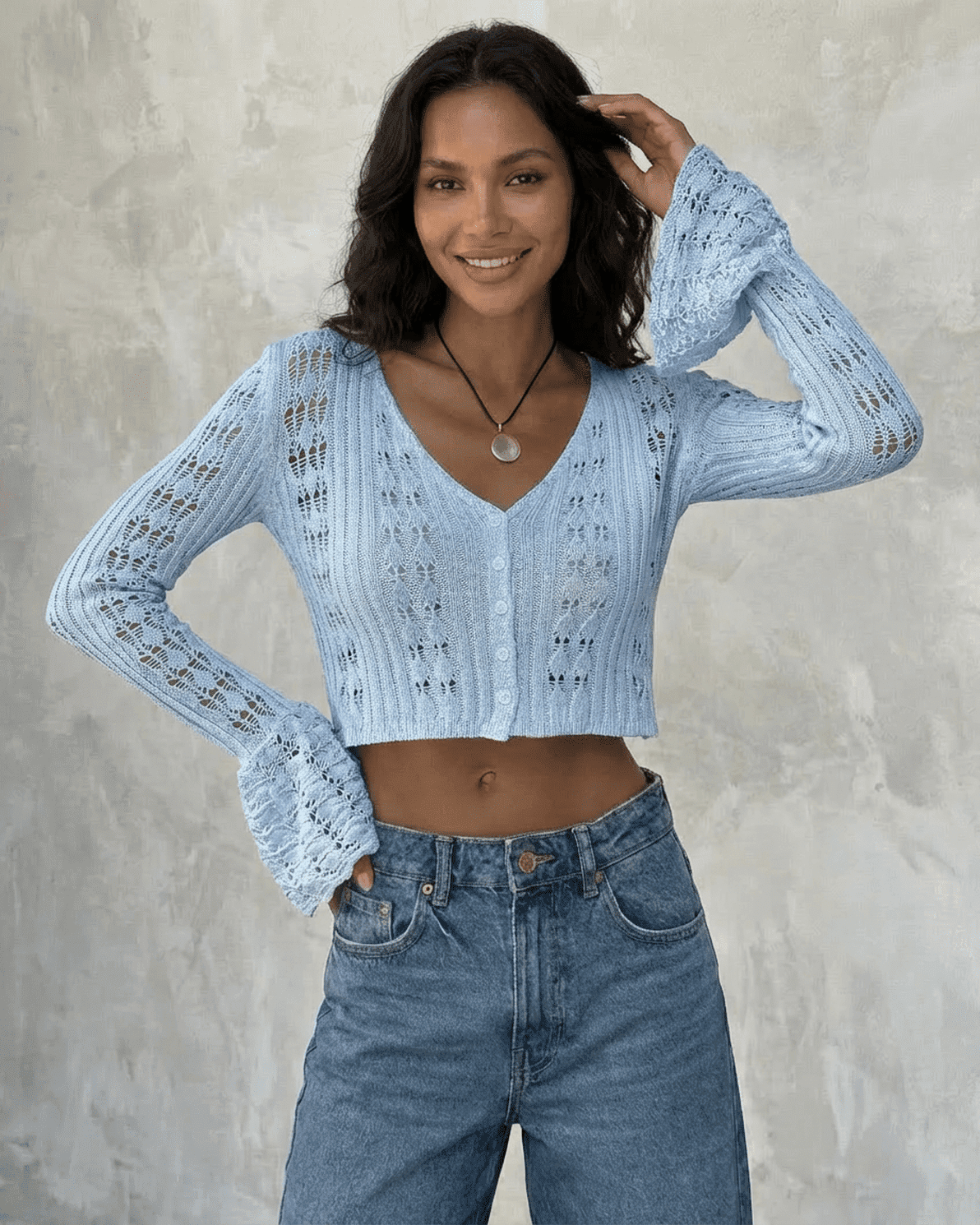 Azure Cardigan by Slimona, a cropped cotton knit with flare sleeves in light blue, styled effortlessly.