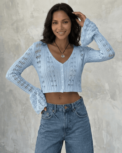 Azure Cardigan by Slimona, a cropped cotton knit with flare sleeves in light blue, styled effortlessly.