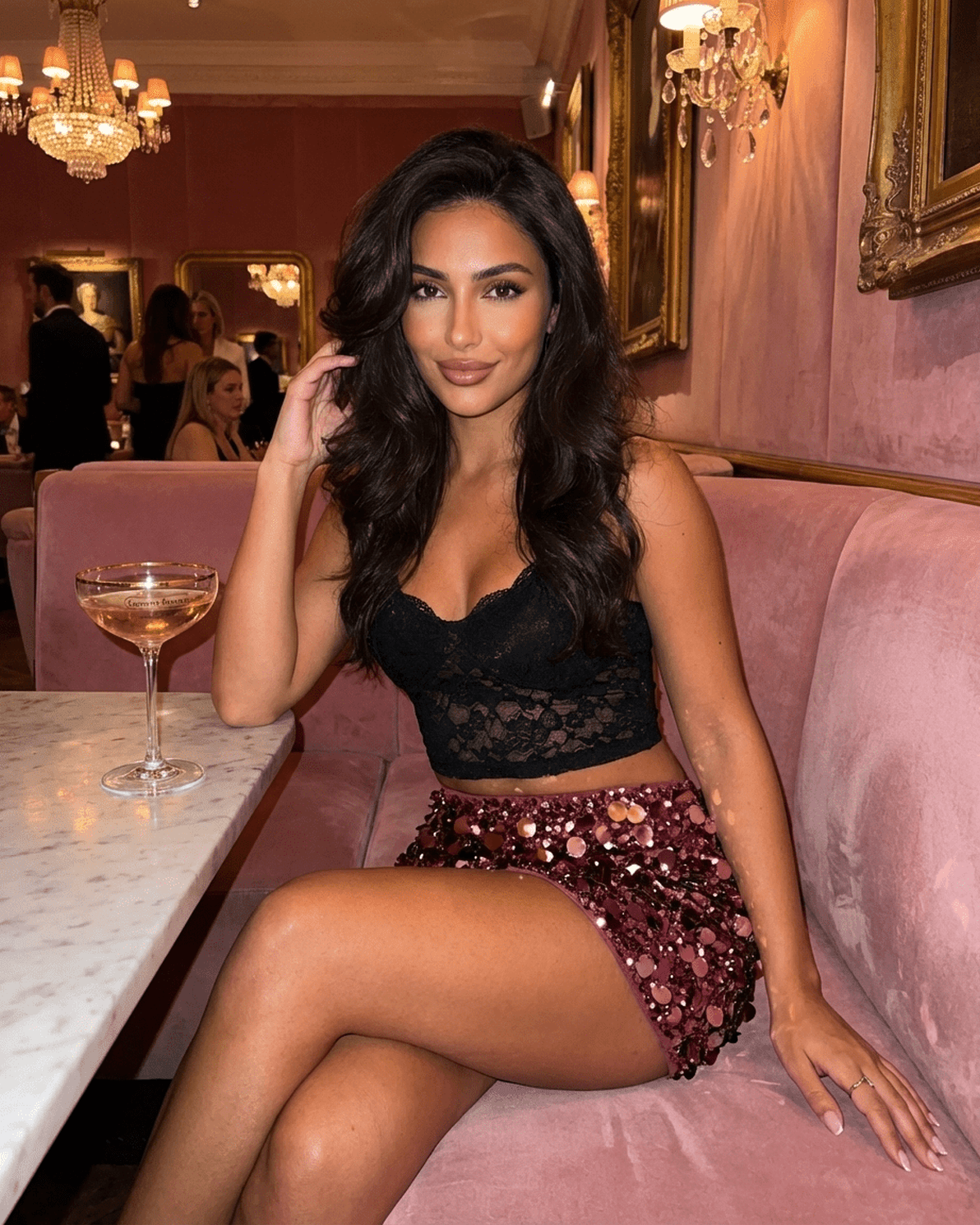 Model in a black top and Bordeaux Mini Skirt with burgundy sequins, posing elegantly at a chic venue.