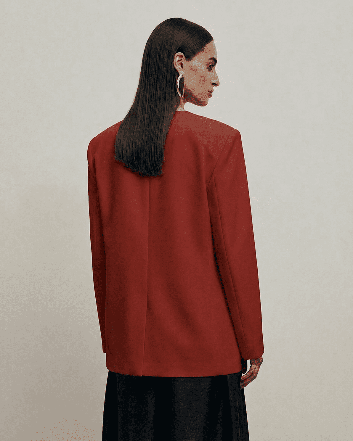 Carmine Blazer by Slimona, showcasing a fitted single-breasted design and structured silhouette in dark red.