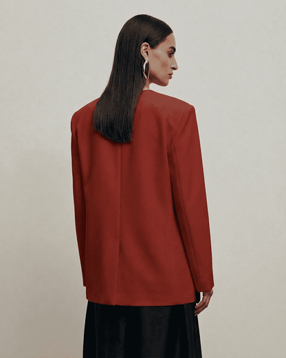 Carmine Blazer by Slimona, showcasing a fitted single-breasted design and structured silhouette in dark red.