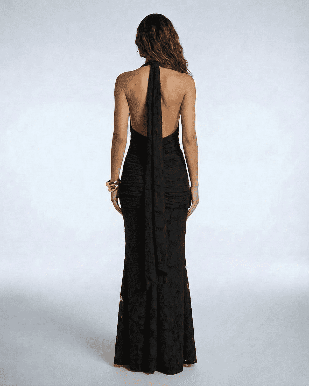 Back view of the Celeste Maxi Dress by Slimona featuring elegant ruched detail and a tie-up ribbon.