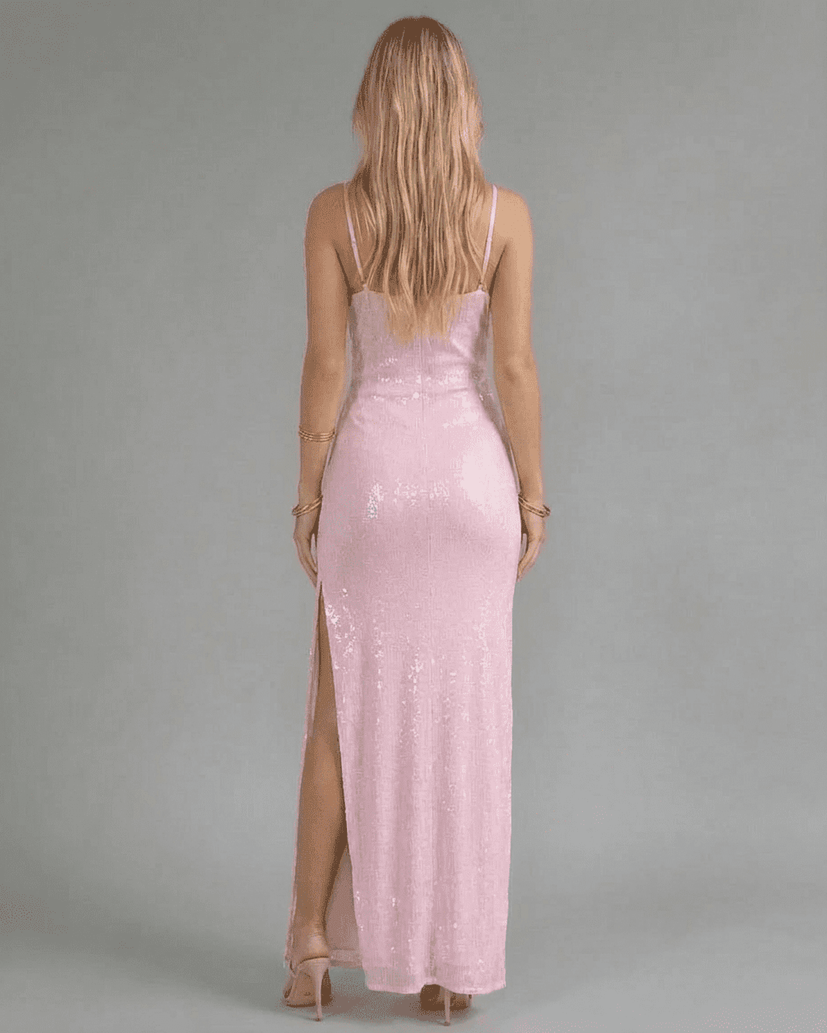 Celeste Maxi Dress by Slimona, showcasing the back view of a pink sequin dress with a high slit.