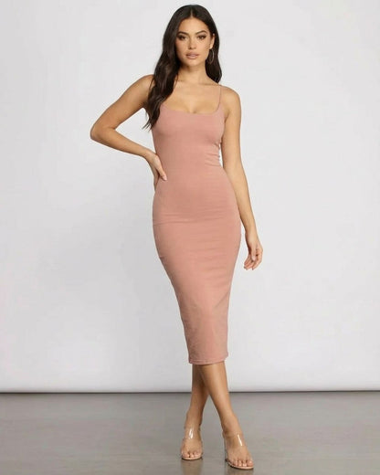 Elegant model wearing Slimona Celeste Midi Dress showcasing its curve-hugging silhouette in soft knit fabric.
