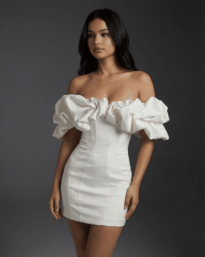 Celeste Mini Dress by Slimona, featuring off-the-shoulder design, ruffle trim, and bodycon silhouette.