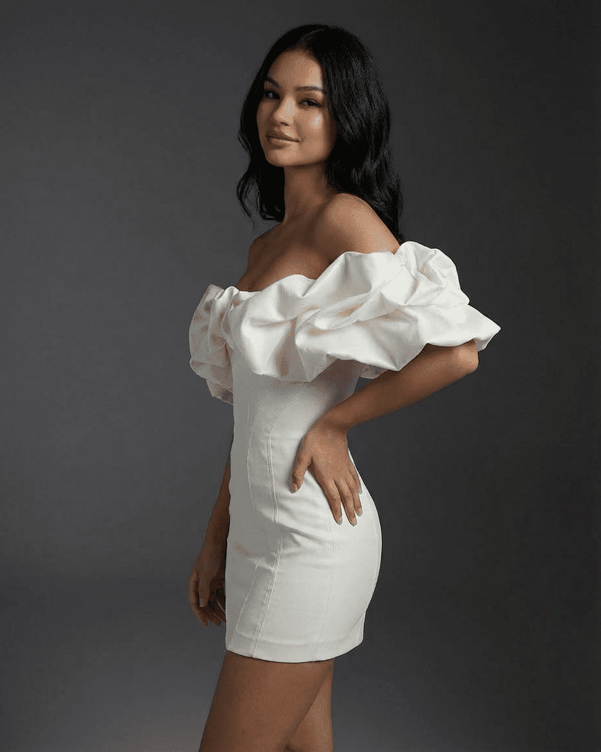 Celeste Mini Dress by Slimona featuring boned structure and ruffle trim, showcased on model in a sleek pose.