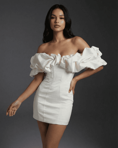 Celeste Mini Dress by Slimona featuring off-the-shoulder design and dramatic ruffle trim for a stylish look.
