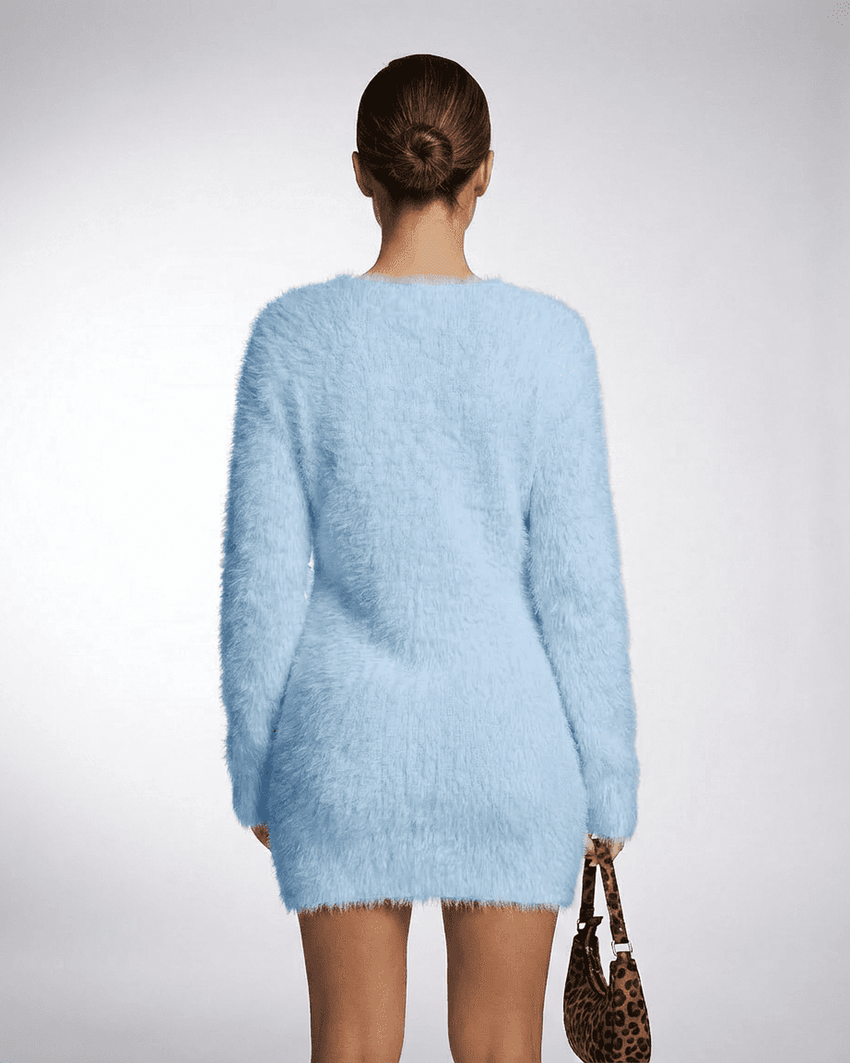 Celeste Sweater by Slimona, showcasing a cozy blue v-neck fuzzy plush knit from the back, perfect for fall and winter.