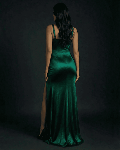Celestine Maxi Dress by Slimona, elegant emerald green satin bodycon dress with high slit, seen from the back.