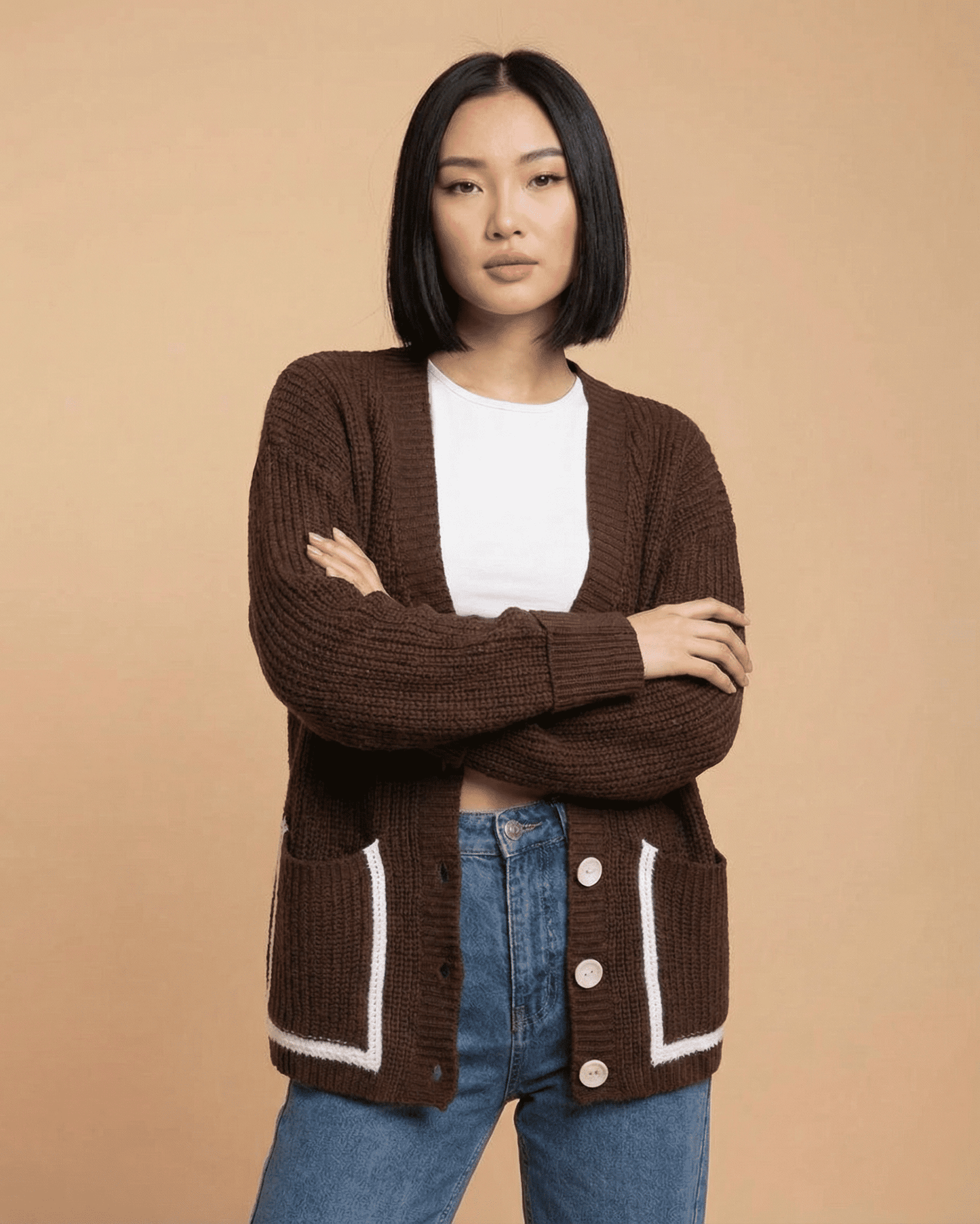 Cocoa Cardigan by Slimona in a color block style, featuring a V-neckline and button front, model wearing it.