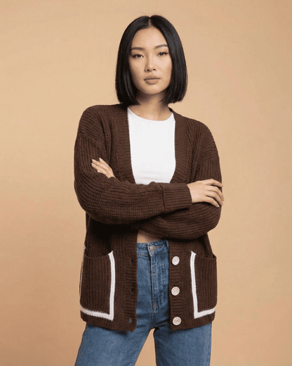 Cocoa Cardigan by Slimona in a color block style, featuring a V-neckline and button front, model wearing it.