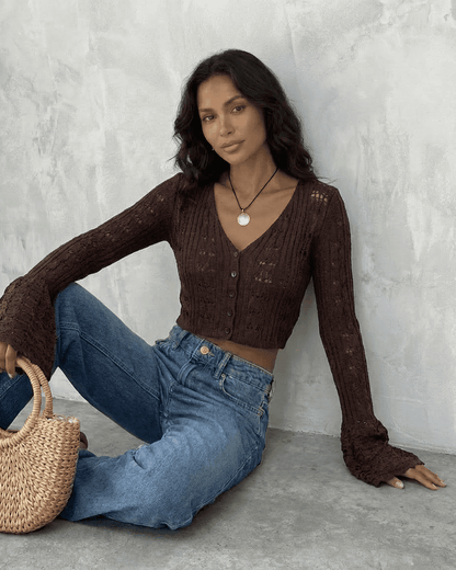 Cocoa Cardigan by Slimona, featuring a cropped cotton knit design with flare sleeves and intricate hollow-out detailing.