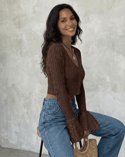 Cocoa Cardigan by Slimona, cropped cotton knit with flare sleeves, showcasing a woman in a stylish pose.