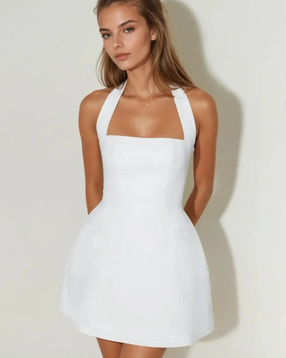 Elegant white halter mini dress with fit-and-flare silhouette, perfect for weddings, proms, and summer occasions.
