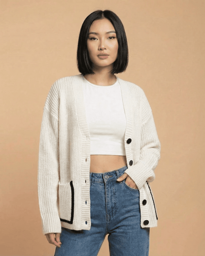 Elara Cardigan by Slimona, loose fit V-neck color block knit cardigan in cream with black accents.