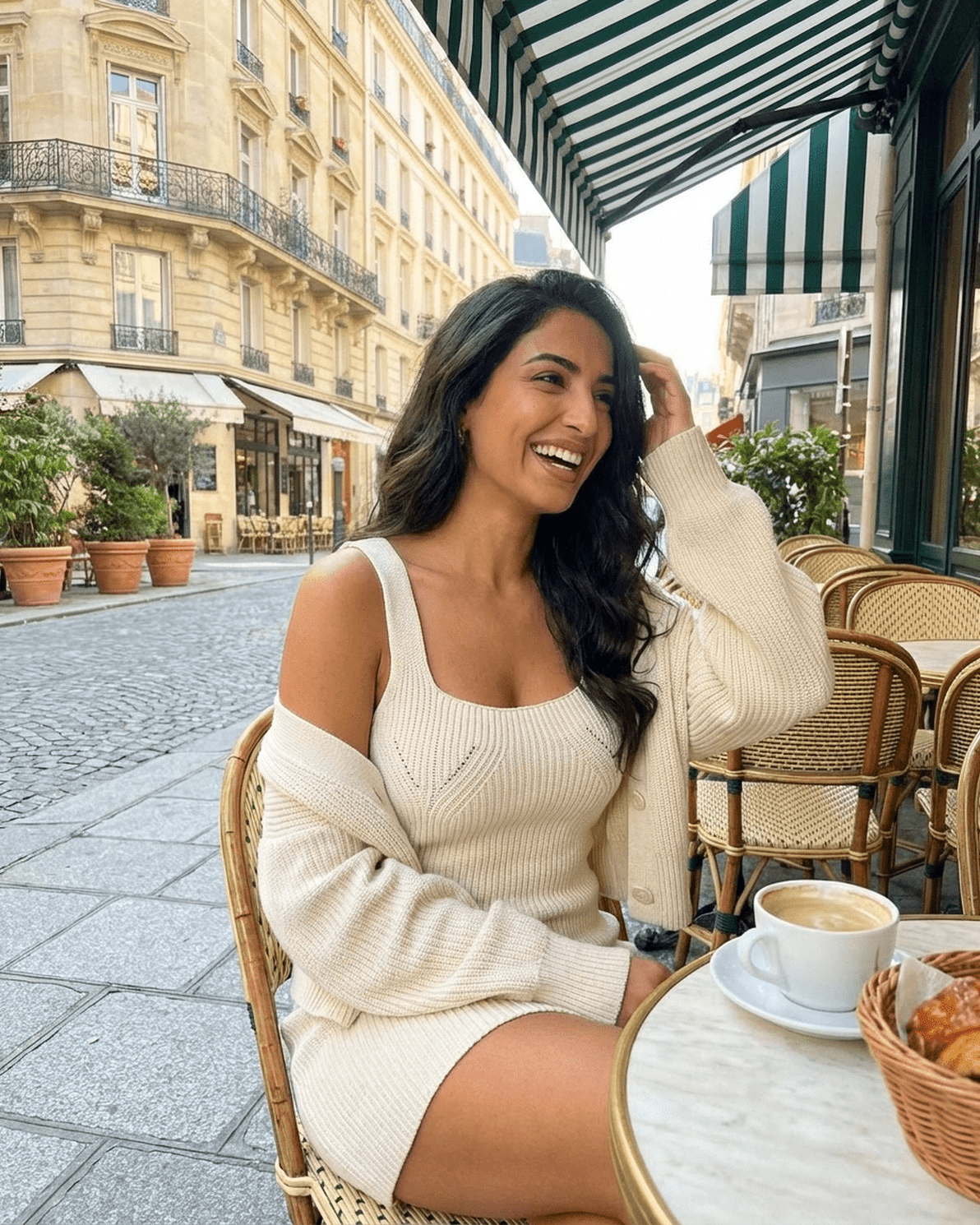 Elysia Mini Dress by Slimona, showcasing a fitted knit design, styled with a cardigan at a chic Parisian café.