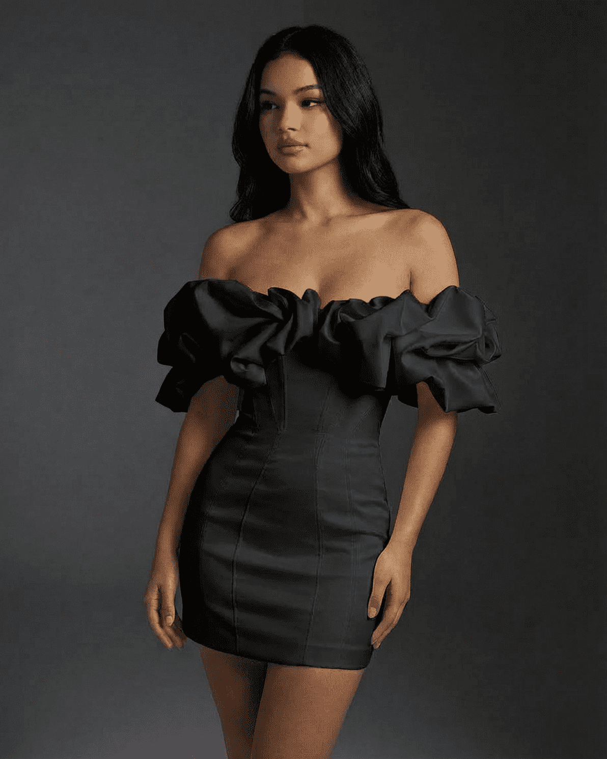 Elysia Mini Dress by Slimona featuring a dramatic off-the-shoulder silhouette and voluminous ruffle trim in black.