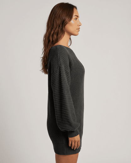 Ember Mini Dress by Slimona, showing side view of ribbed knit off-the-shoulder lantern sleeve in charcoal.