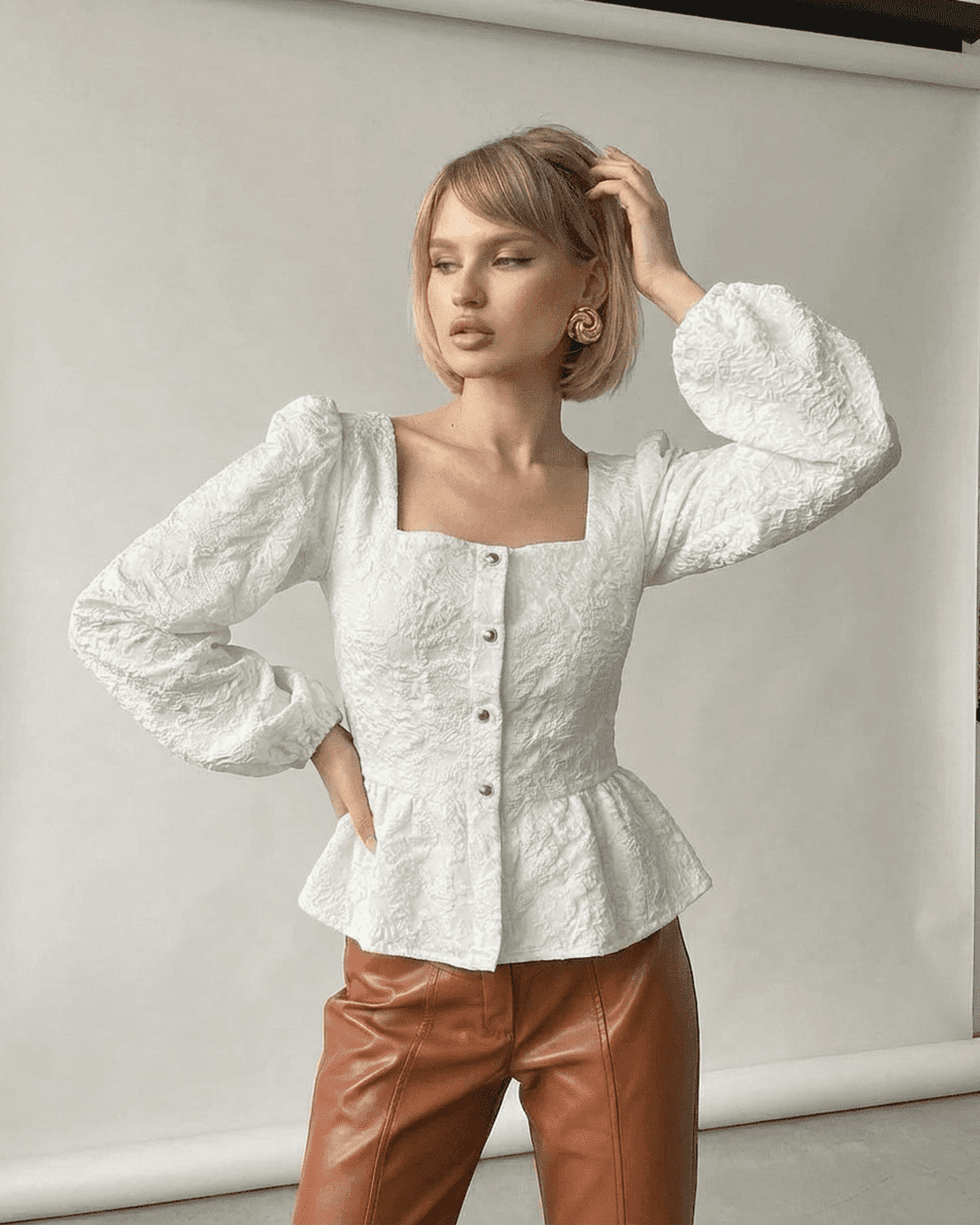 Ivory Corset Top by Slimona, featuring a jacquard fabric, square neckline, and puff sleeves for a sophisticated look.