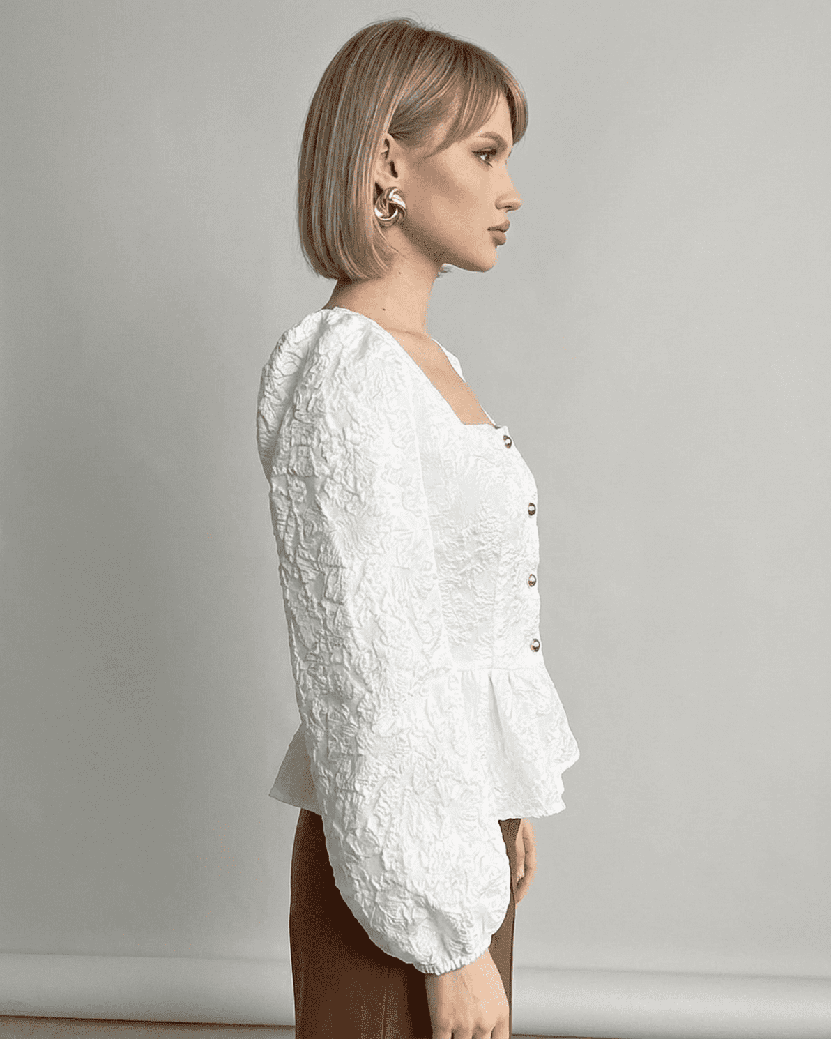 Ivory Corset Top by Slimona, featuring jacquard fabric and puff sleeves, showcasing a refined and elegant look.