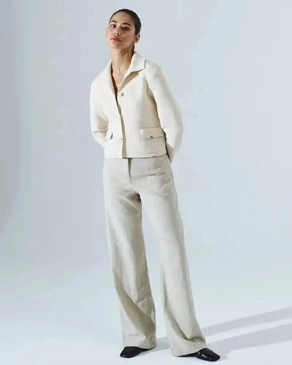 Lazio Cropped Jacket worn by a model, showcasing elegant cream design from Slimona brand, perfect for stylish occasions.