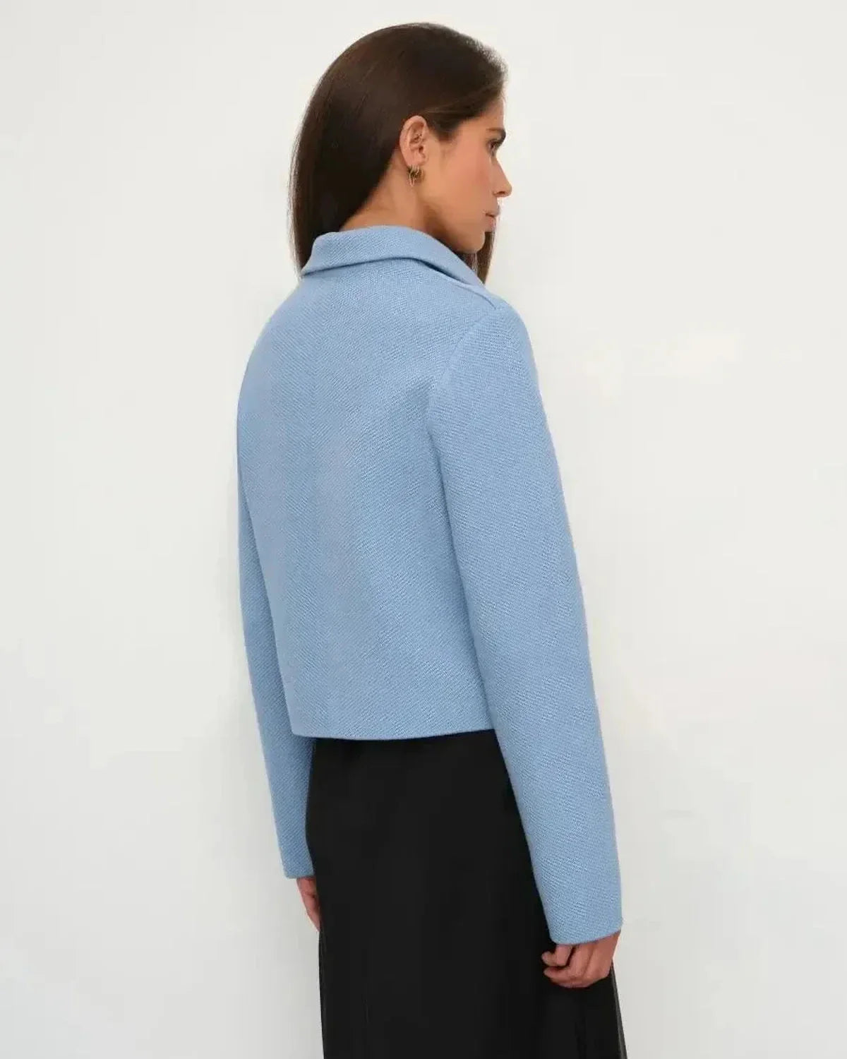 Lazio Jacket by Slimona, cropped light blue women's jacket showcasing a structured silhouette from the back.