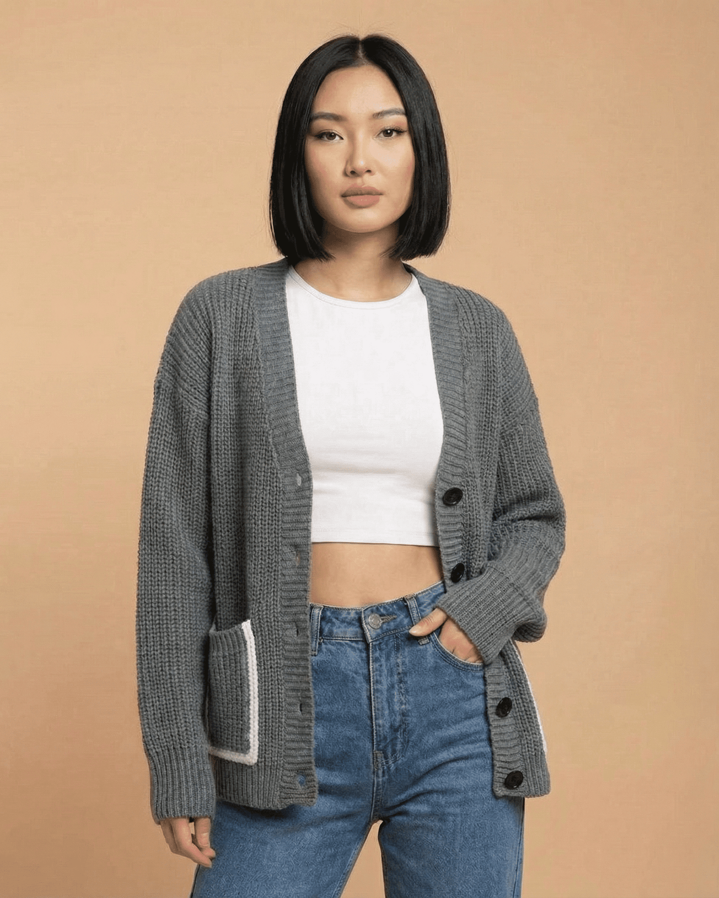 Stylish woman wearing a Slimona Linden Cardigan with a relaxed V-neck and button-front closure.