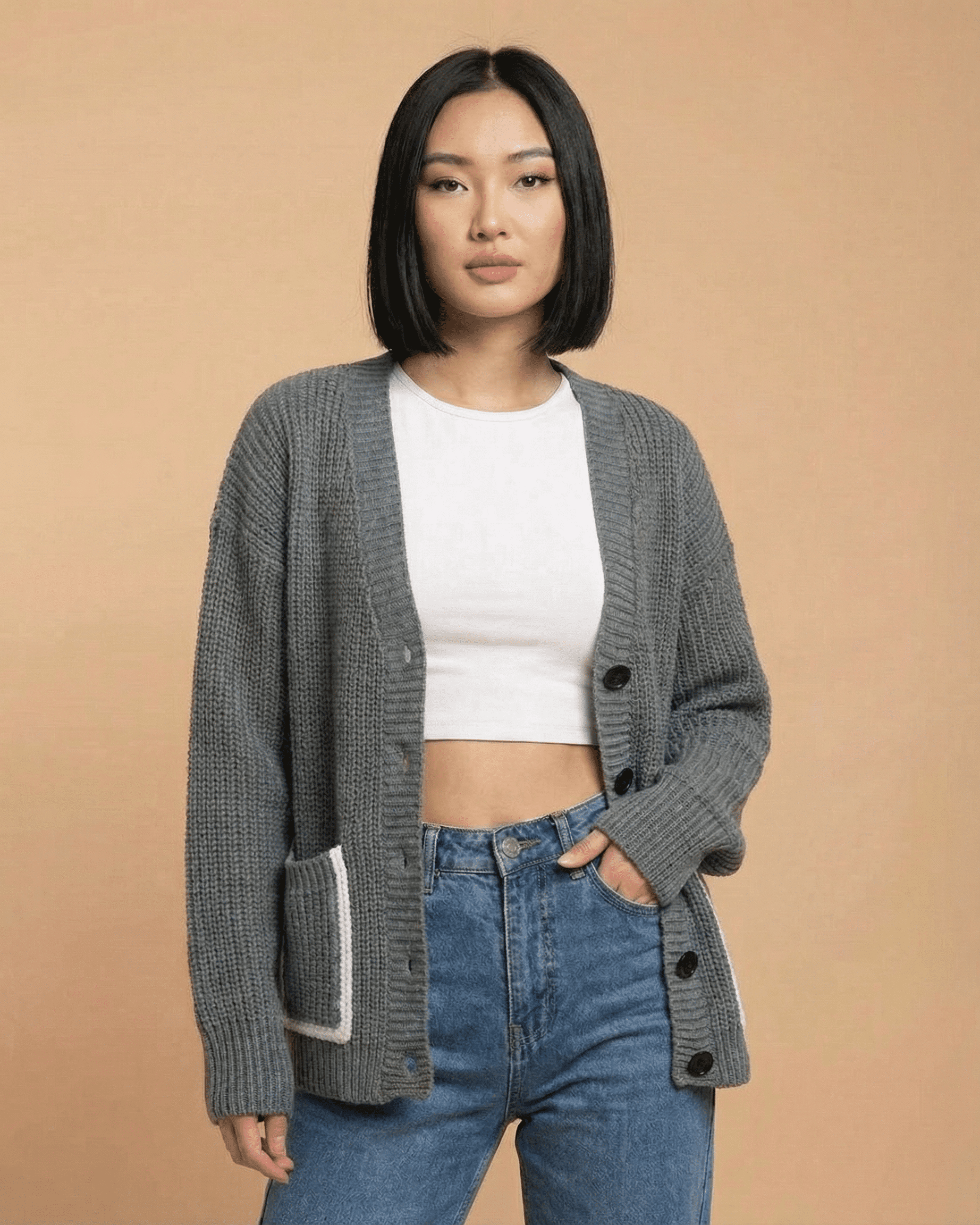 Stylish woman wearing a Slimona Linden Cardigan with a relaxed V-neck and button-front closure.