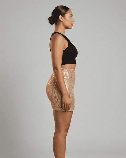 Lumiere Mini Skirt by Slimona - Sequin high waist bodycon mini skirt showcasing a side profile with a flattering fit.