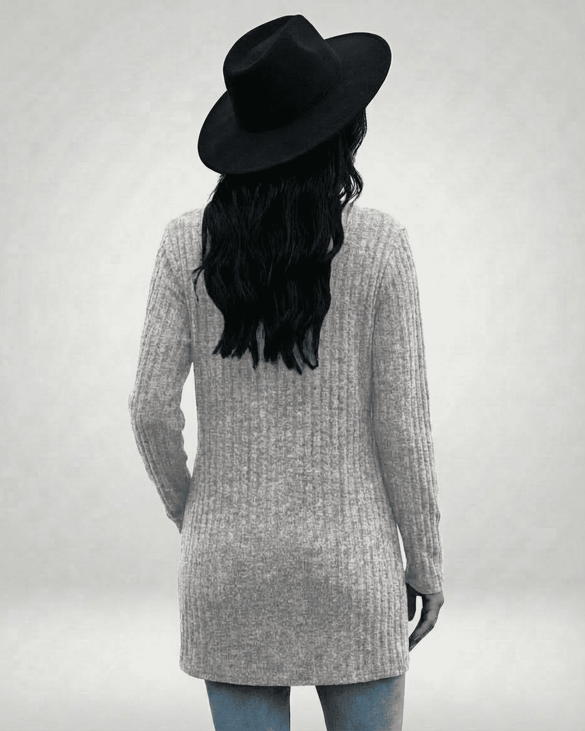 Back view of a model wearing the Luna Cardigan by Slimona, featuring a longline silhouette and ribbed knit texture.
