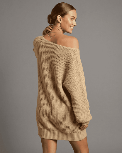 Luna Mini Dress by Slimona, showcasing a cozy beige knit fabric with an off-the-shoulder design and relaxed fit.