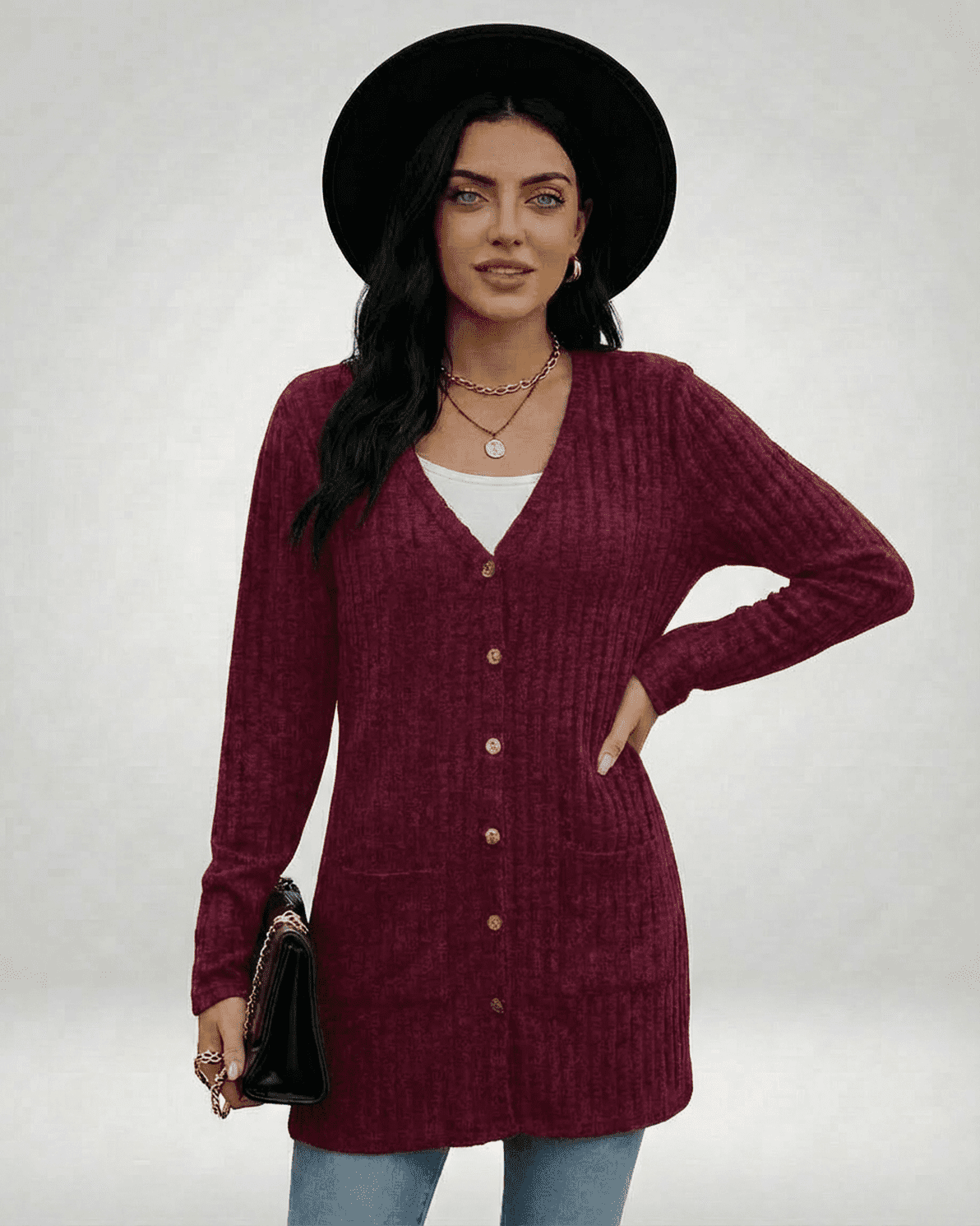 Woman wearing Slimona Merlot Cardigan, a longline button-front knitwear in deep red with classic V-neckline.