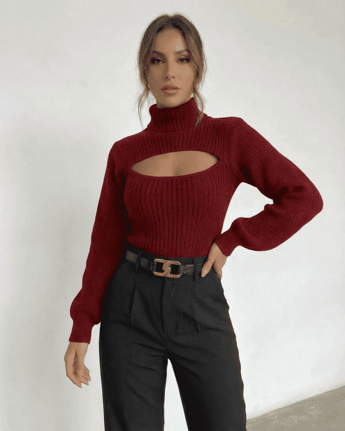 Slimona Merlot Sweater featuring mock neck and cut out detail, styled with high-waisted pants for a chic look.