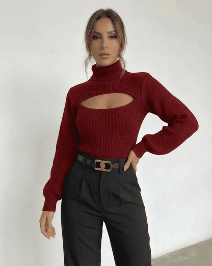 Slimona Merlot Sweater featuring mock neck and cut out detail, styled with high-waisted pants for a chic look.