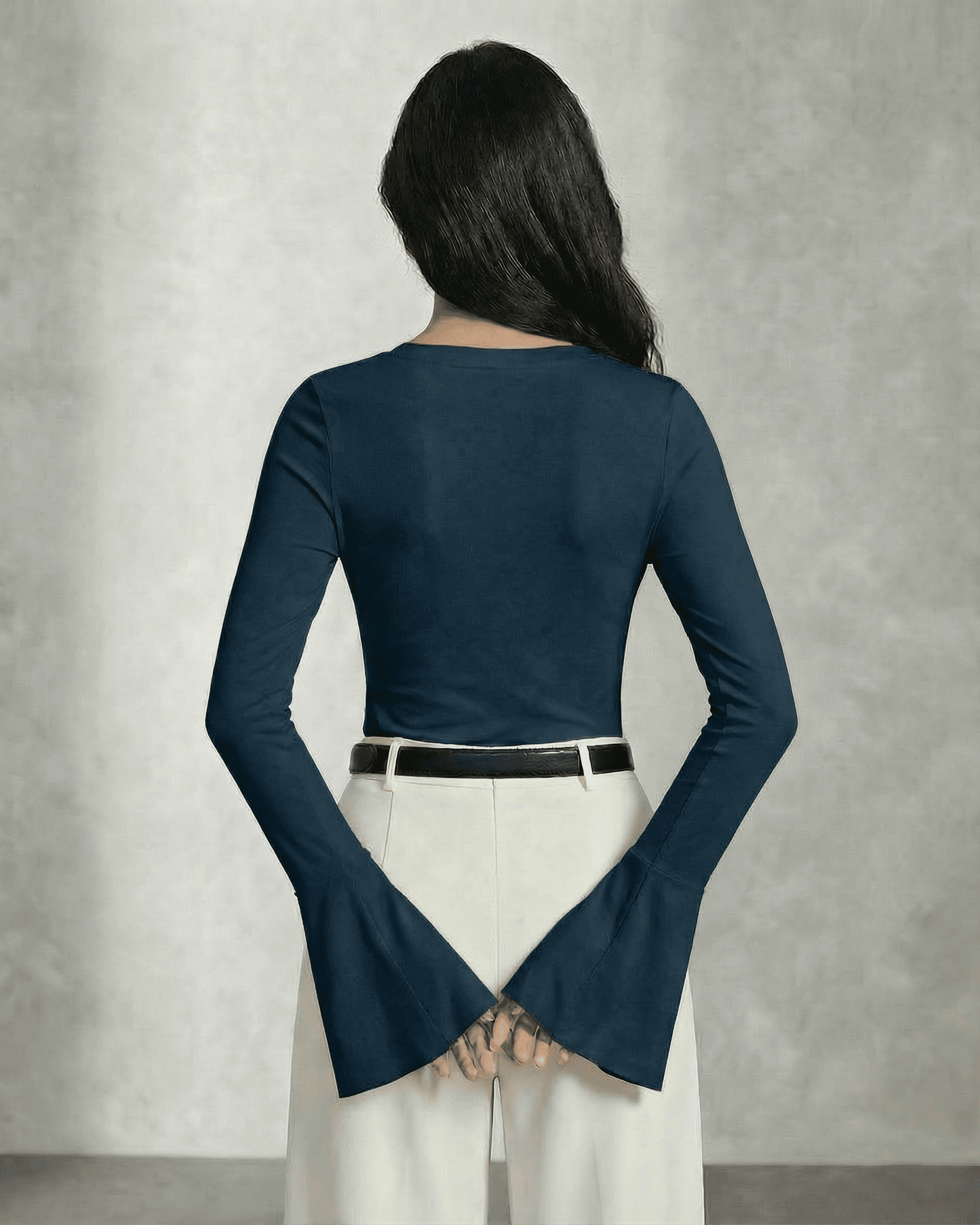 Nocturne Blouse by Slimona viewed from the back showcasing long sleeves and elegant bell cuffs.