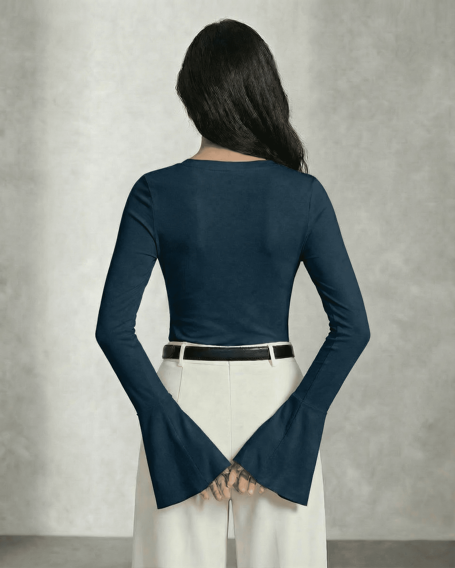 Nocturne Blouse by Slimona viewed from the back showcasing long sleeves and elegant bell cuffs.