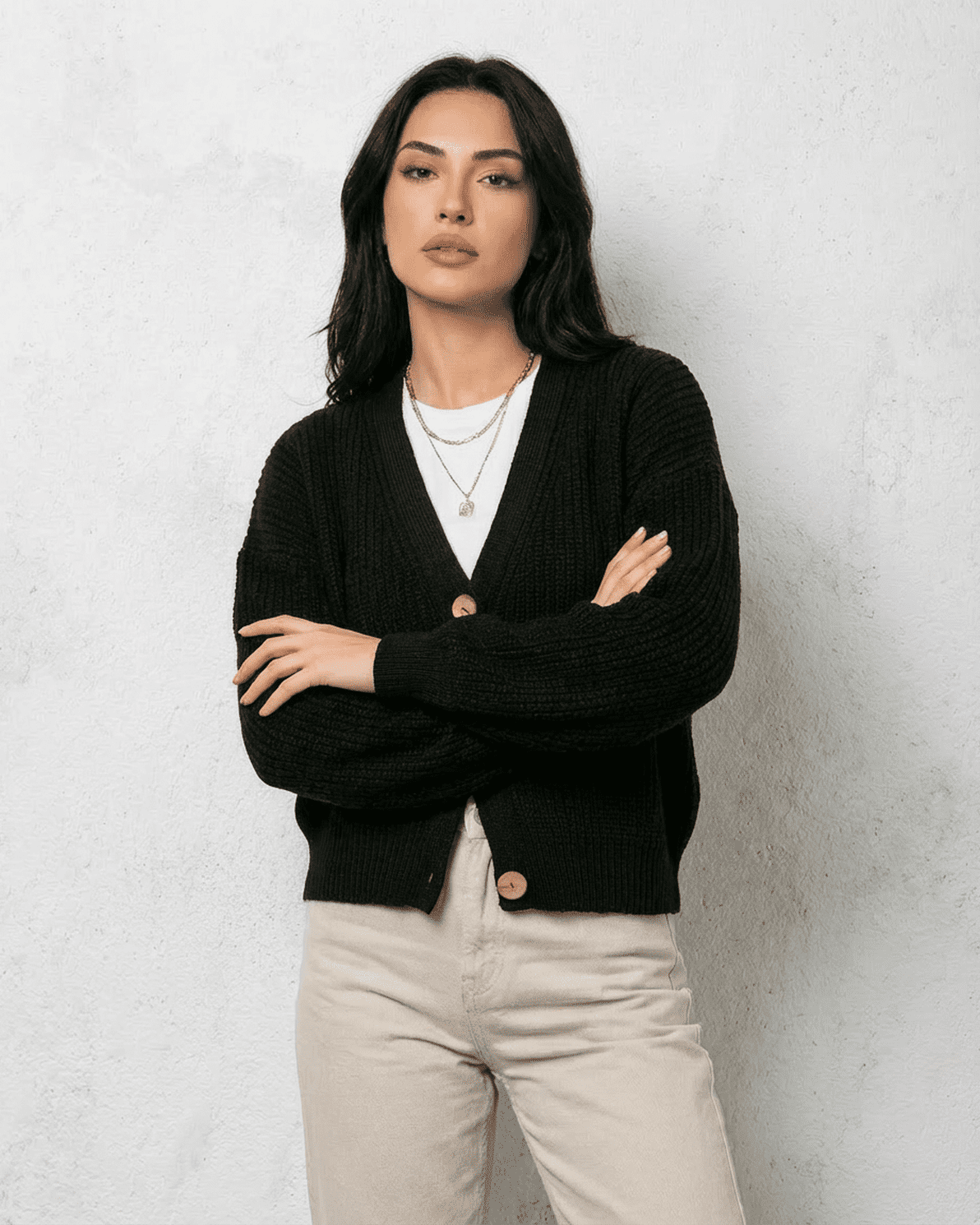 Noir Cardigan by Slimona - Sleek black knitwear with classic V-neck and button detail.