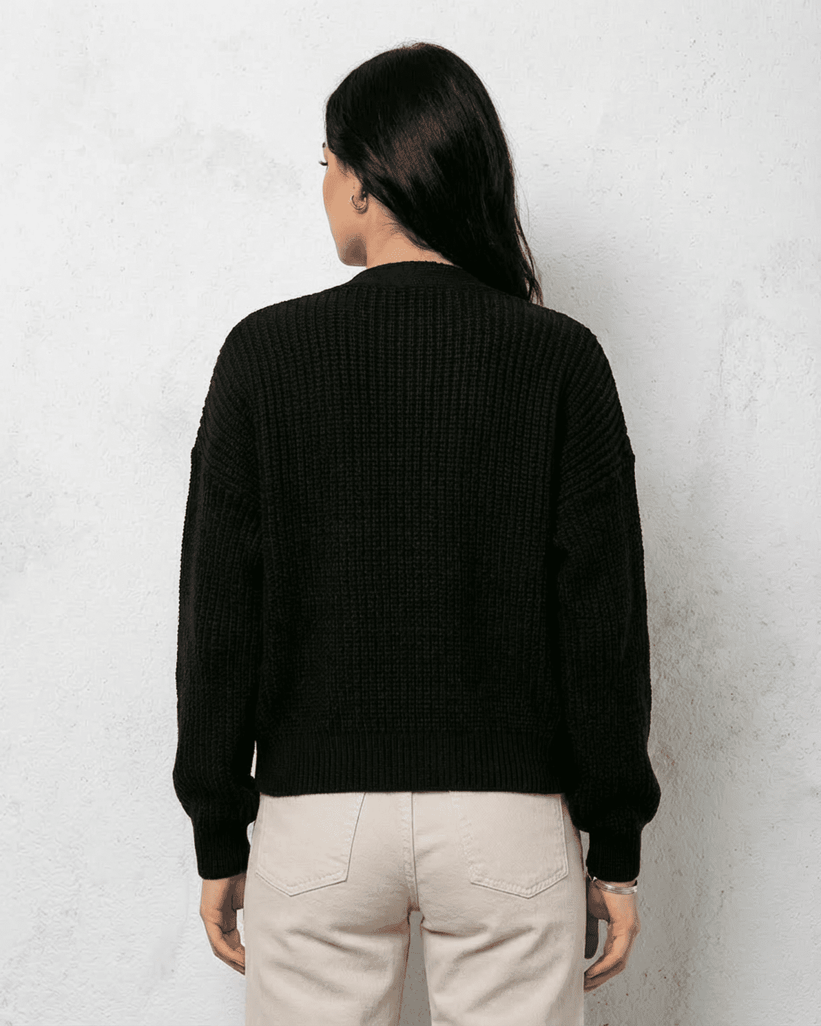 Noir Cardigan by Slimona, showcasing the back view of a sleek black knitwear piece with cozy fit.