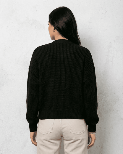 Noir Cardigan by Slimona, showcasing the back view of a sleek black knitwear piece with cozy fit.