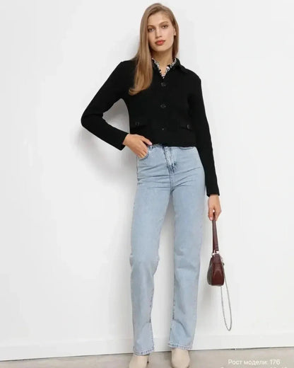 Noir Jacket by Slimona: Cropped black women's jacket with button closure, styled with light jeans.