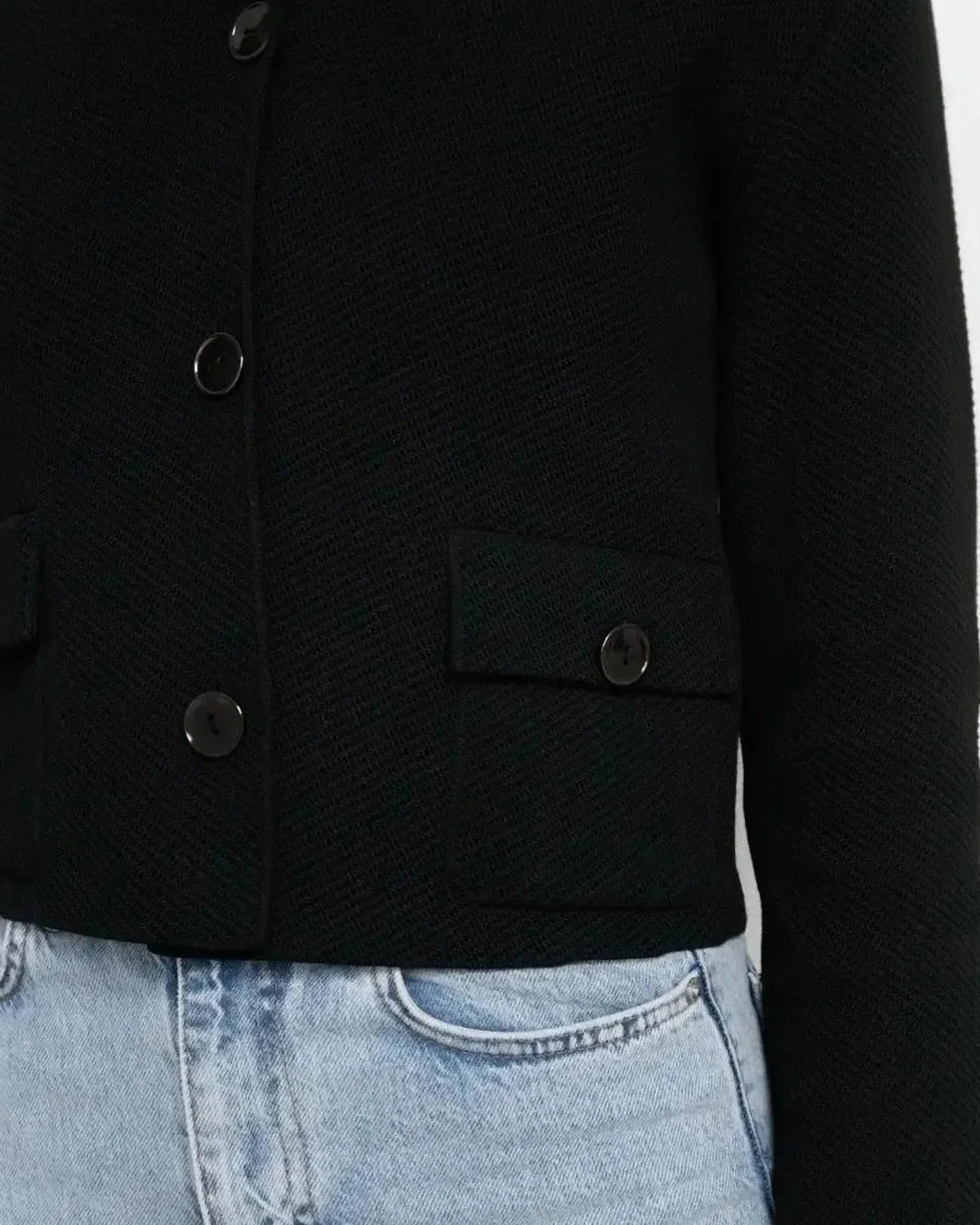 Noir Jacket by Slimona – Cropped black women’s jacket with button closure and pockets.