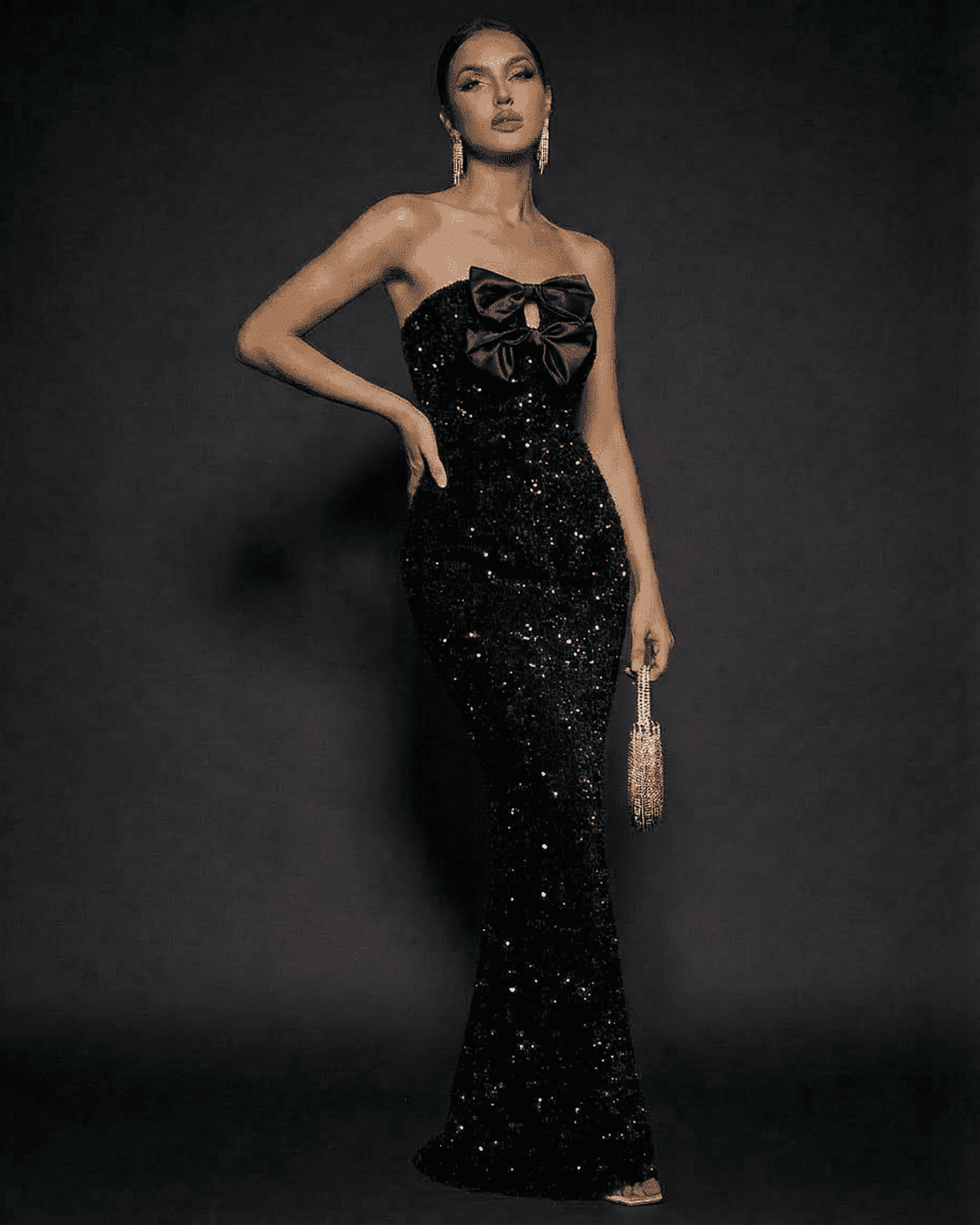 Elegant Noir Maxi Dress by Slimona, strapless sequin gown with satin bows for a glamorous evening look.