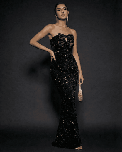 Elegant Noir Maxi Dress by Slimona, strapless sequin gown with satin bows for a glamorous evening look.