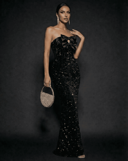 Elegant Noir Maxi Dress by Slimona, featuring sequins and satin bows, perfect for formal occasions.