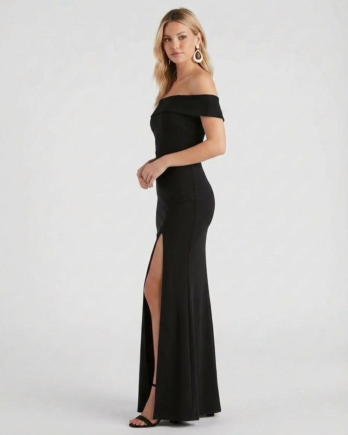 Slimona Noiré Maxi Dress in black, featuring off shoulder design and side slit for an elegant evening look.