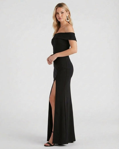 Slimona Noiré Maxi Dress in black, featuring off shoulder design and side slit for an elegant evening look.