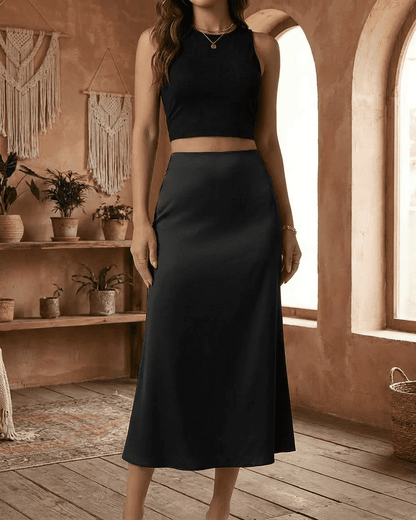 Noirelle Midi Skirt by Slimona - Sleek satin mermaid midi skirt in black, perfect for timeless elegance.