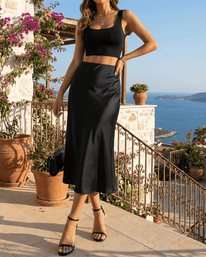 Noirelle Midi Skirt by Slimona, showcasing a sleek satin mermaid design in classic black, perfect for elegant summer evenings.
