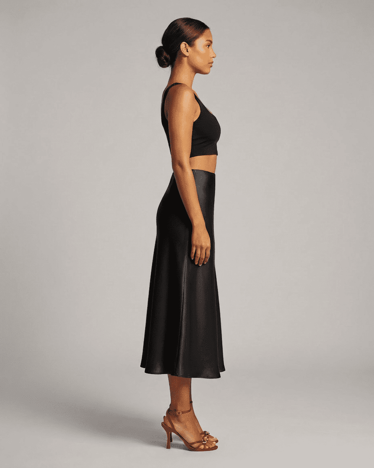 Noirelle Midi Skirt by Slimona, satin mermaid midi skirt in classic black, showcasing timeless elegance.