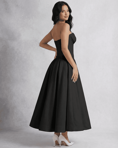 Nova Midi Dress by Slimona featuring a strapless corset design and flowing A-line silhouette in elegant black.